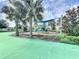 Community playground with shaded play structure and soft ground at 1065 Blackwolf Run Rd, Davenport, FL 33896