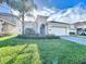 Beautiful two-story house with a landscaped yard at 1065 Blackwolf Run Rd, Davenport, FL 33896