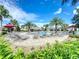 Community pool with plenty of lounge chairs at 1065 Blackwolf Run Rd, Davenport, FL 33896