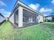 House exterior with screened patio and landscaping at 1065 Blackwolf Run Rd, Davenport, FL 33896
