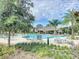 Community pool with thatched-roof cabana at 1065 Blackwolf Run Rd, Davenport, FL 33896