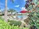 Resort-style pool with lounge chairs and landscaping at 1065 Blackwolf Run Rd, Davenport, FL 33896
