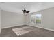 Spacious bedroom with ceiling fan and carpet at 5437 Hansel Ave # J10, Orlando, FL 32809