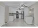 Modern kitchen featuring stainless steel appliances and white cabinetry at 5437 Hansel Ave # J10, Orlando, FL 32809