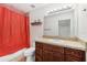 Clean bathroom with a vanity, toilet and shower/tub combo at 210 Majors Ln # B, Kissimmee, FL 34743