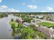 An aerial view showcasing the lakefront location and townhouses at 210 Majors Ln # B, Kissimmee, FL 34743