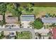 Overhead view of townhouses with parking and a lake nearby at 210 Majors Ln # B, Kissimmee, FL 34743
