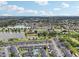 Aerial view of a townhouse community with a pool, showcasing the amenities at 210 Majors Ln # B, Kissimmee, FL 34743