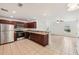 Kitchen with dark wood cabinets, stainless steel appliances, and granite countertops at 210 Majors Ln # B, Kissimmee, FL 34743