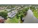 Aerial view of townhouses next to a calm lake at 210 Majors Ln # B, Kissimmee, FL 34743