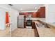 Kitchen featuring stainless steel appliances and a view into the bathroom at 210 Majors Ln # B, Kissimmee, FL 34743