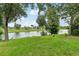 Scenic waterfront view with lush greenery at 210 Majors Ln # B, Kissimmee, FL 34743