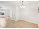 Simple dining area with tile floors and a light fixture at 210 Majors Ln # B, Kissimmee, FL 34743