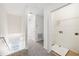 Upper-level laundry room with built-in shelving and vinyl flooring at 210 Majors Ln # B, Kissimmee, FL 34743