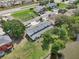 Aerial view of two townhouses nestled near a lake at 210 Majors Ln # B, Kissimmee, FL 34743