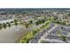 Aerial view of a lakefront townhouse community, showing its size and layout at 210 Majors Ln # B, Kissimmee, FL 34743