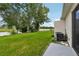Backyard with grass, patio, and lake view at 210 Majors Ln # B, Kissimmee, FL 34743