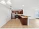 Modern kitchen featuring dark wood cabinets and stainless steel appliances at 210 Majors Ln # B, Kissimmee, FL 34743