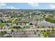 Aerial view of a community with lakefront properties and lush landscaping at 210 Majors Ln # B, Kissimmee, FL 34743