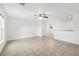 Open concept living room with tile flooring and ceiling fan at 210 Majors Ln # B, Kissimmee, FL 34743