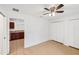 Bedroom with tile floors, double closets, and kitchen access at 210 Majors Ln # B, Kissimmee, FL 34743