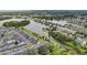 Aerial view of a tranquil lakefront townhouse community at 210 Majors Ln # B, Kissimmee, FL 34743