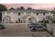 Two-story building exterior, showing parking and landscaping at 210 Majors Ln # B, Kissimmee, FL 34743