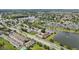 Aerial view showing the community's location near a lake and surrounding neighborhood at 210 Majors Ln # B, Kissimmee, FL 34743