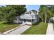 Charming bungalow-style home with a well-maintained lawn at 1700 Minnesota Ave, St Cloud, FL 34769