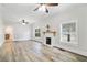 Living room with hardwood floors and a fireplace at 1700 Minnesota Ave, St Cloud, FL 34769