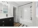 Clean bathroom, bathtub, and dark vanity at 1700 Minnesota Ave, St Cloud, FL 34769