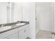 Bathroom with granite countertop and double sinks at 523 Kennedy Dr, Lake Alfred, FL 33850