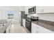 Modern kitchen with stainless steel appliances and an island at 523 Kennedy Dr, Lake Alfred, FL 33850