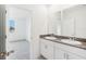 Bright bathroom with double vanity and granite countertop at 523 Kennedy Dr, Lake Alfred, FL 33850