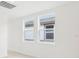 Bright bedroom with two large windows and tile flooring at 523 Kennedy Dr, Lake Alfred, FL 33850