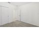 Spacious bedroom with neutral carpeting and double closets at 523 Kennedy Dr, Lake Alfred, FL 33850