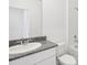 Clean bathroom with granite countertop, single sink, and shower at 523 Kennedy Dr, Lake Alfred, FL 33850