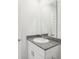 Simple bathroom with granite countertop and single sink vanity at 523 Kennedy Dr, Lake Alfred, FL 33850