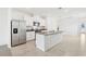 Modern kitchen with stainless steel appliances and an island at 523 Kennedy Dr, Lake Alfred, FL 33850