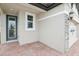 Front porch with brick paved flooring and access to the garage at 523 Kennedy Dr, Lake Alfred, FL 33850