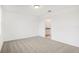 Bedroom with access to bathroom and carpet flooring at 523 Kennedy Dr, Lake Alfred, FL 33850