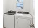 Laundry room with Whirlpool washer and dryer at 523 Kennedy Dr, Lake Alfred, FL 33850