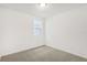 Bright bedroom with neutral carpeting and a window at 523 Kennedy Dr, Lake Alfred, FL 33850