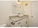 Bathroom with vanity and a large mirror at 5467 Vineland Rd # 6308, Orlando, FL 32811