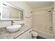 Bathroom with granite vanity and updated bathtub at 5467 Vineland Rd # 6308, Orlando, FL 32811