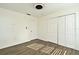 Bedroom with double door closet and wood floors at 5467 Vineland Rd # 6308, Orlando, FL 32811