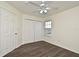Spacious bedroom with wood floors and window at 5467 Vineland Rd # 6308, Orlando, FL 32811