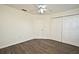 Bedroom with ceiling fan and double door closet at 5467 Vineland Rd # 6308, Orlando, FL 32811