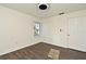 Bright bedroom with wood floors and a ceiling fan at 5467 Vineland Rd # 6308, Orlando, FL 32811