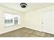 Bedroom with ceiling fan and wood floors at 5467 Vineland Rd # 6308, Orlando, FL 32811